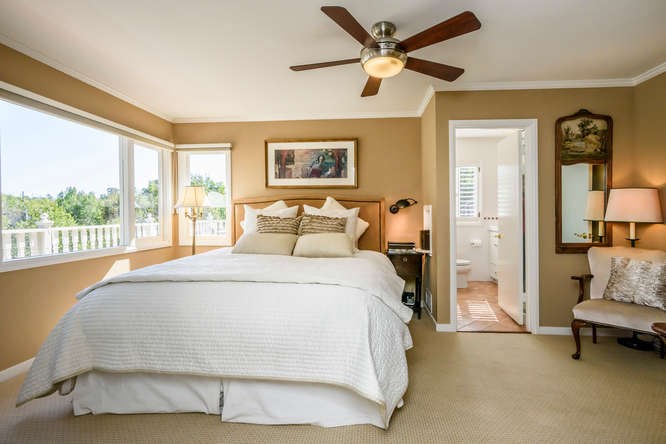 master bedroom suite enjoys private wrap-around deck with treetop views