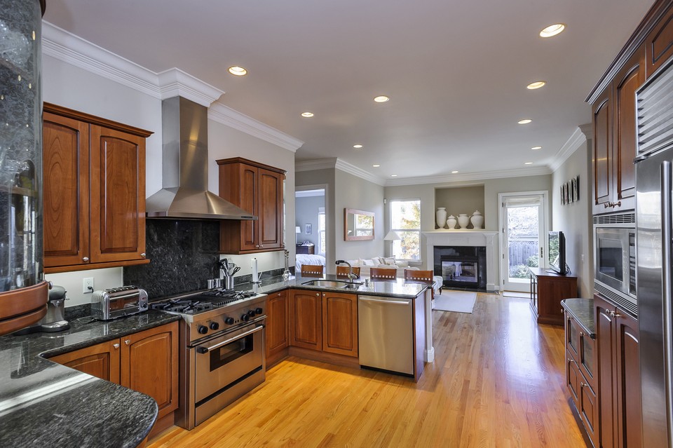 expansive kitchen and family room opens to rear deck and gardens