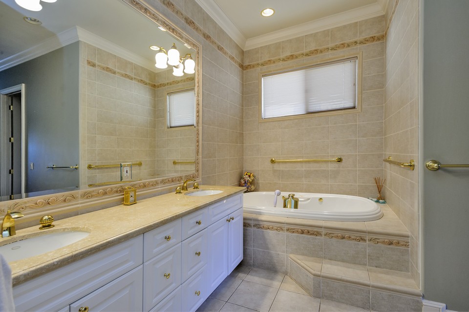 luxurious and spacious master bath with spa tub and separate shower
