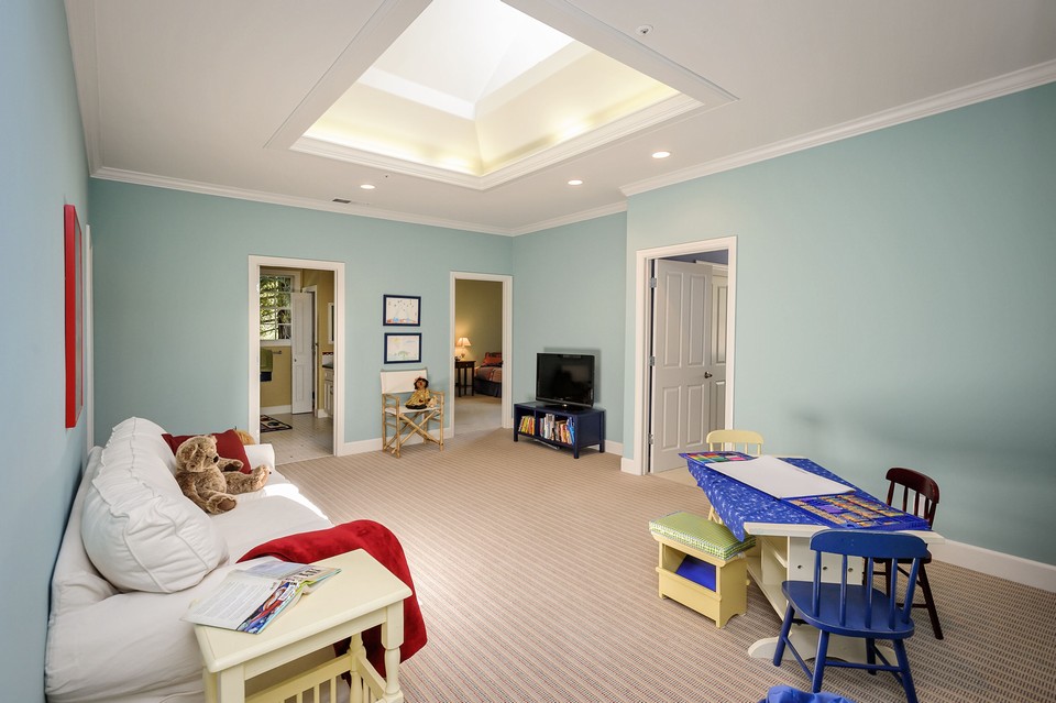 three additional main level bedrooms with shared playroom