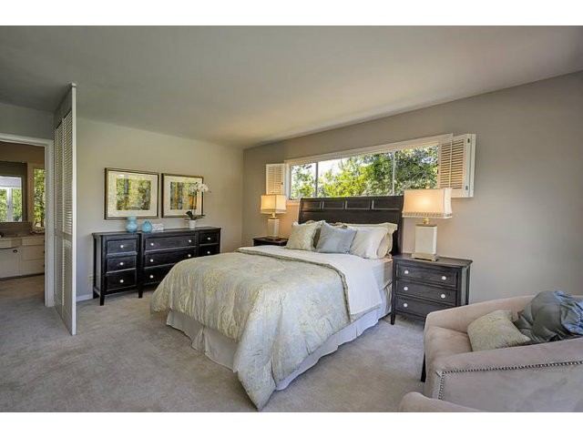 private master suite with views of pool and expansive lawn