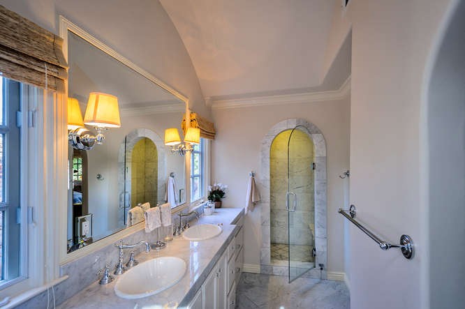 remodeled master bath with marble throughout