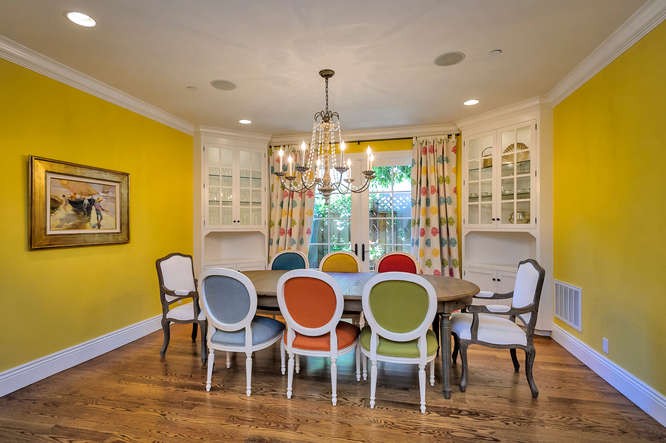 dining room with french doors opening to lush gardens