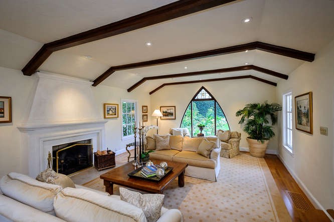 formal living room with original beamed ceilings