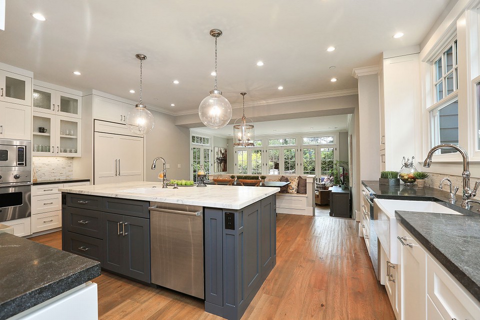 expansive showpiece kitchen with large calacatta topped center island