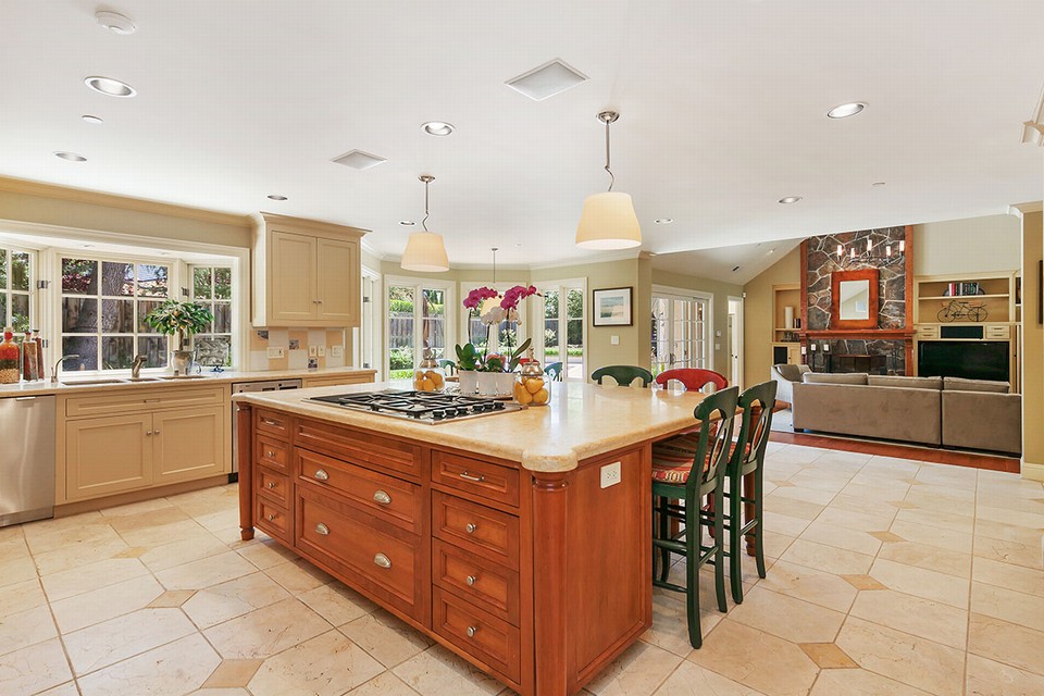 expansive showpiece kitchen with large calacatta topped center island