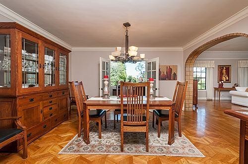 formal dining room with french doors to home office