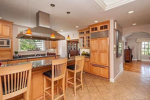 chef's kitchen includes a breakfast bar and breakfast nook