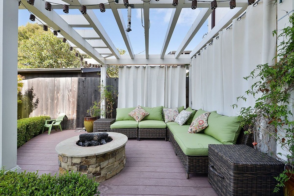 outdoor entertaining area with pergola, projector arm and fire-pit