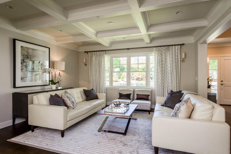 formal living room with box-beamed ceilings